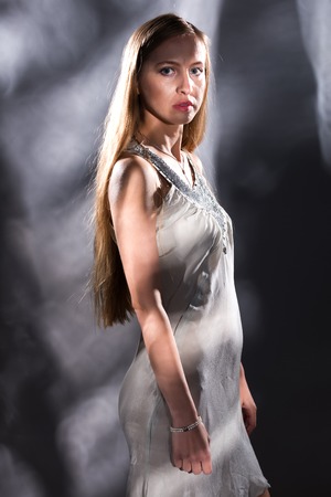 Pretty young Russian blonde in a white sleeveless topの写真素材