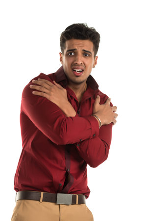 Handsome young Indian man with a frightened expressionの写真素材