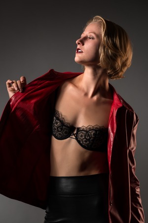 Beautiful young blonde in red and blackの写真素材