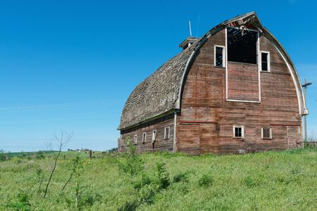 Old wooden barn on a hill, Colfax, Washingtonのeditorial素材