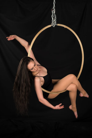 Petite young brunette on an aerial ringの写真素材