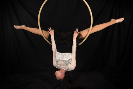 Petite young brunette on an aerial ringの写真素材
