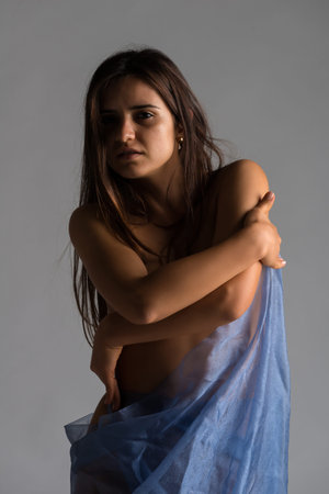 Pretty Romanian brunette wrapped in blue tulle