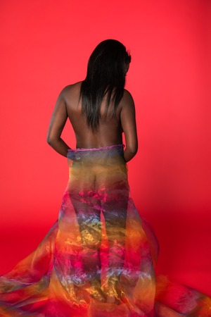 Shapely Ghanaian woman wrapped in sheer multicolored fabricの写真素材