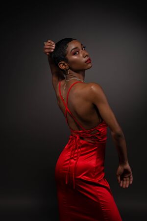 Slender young African American woman in a tight red dressの写真素材