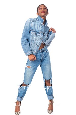 Slender young African American woman in distressed denimの写真素材