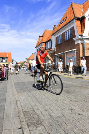 Danish man bicycling on street in Denmarkのeditorial素材