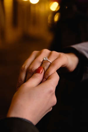 Real life proposal: Brides friend checks out the engagement ring - A ring with a big gemの写真素材