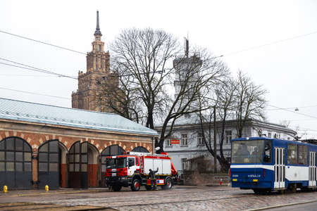 RIGA, LATVIA - MARCH 16, 2019: Fire truck is being cleaned - Driver washes firefighter truck at a...