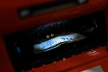 20 euro banknotes at ATM machine in the bank in Shopping centre