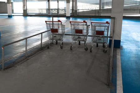 Shopping carts to take - Free vacant parking lot space in a Shopping centre multi story car park