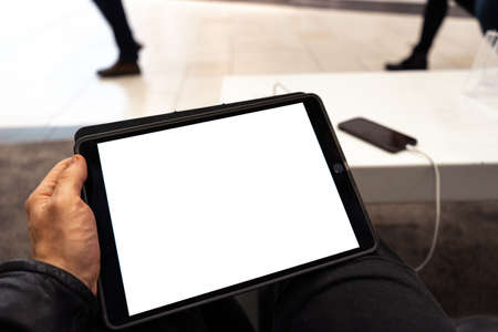 Real life use of tablet with free copy space for your ad and text - Mock up billboard and empty screenの写真素材