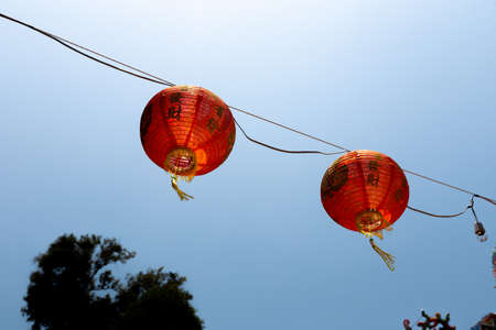 KO CHANG, THAILAND - APRIL 10, 2018: Chinese buddist temple in the north area of the island - Hieroglyphs and patterns with primary RED colorのeditorial素材