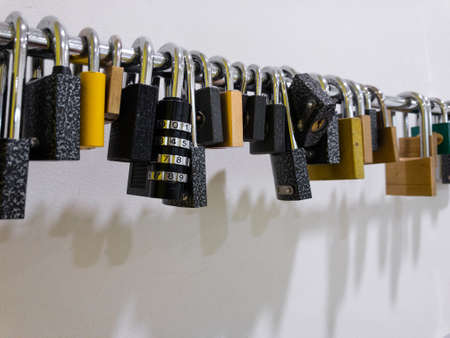 Array of pad locks hanging in a gym on the wallの写真素材