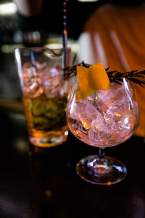 Cocktails by a barmen in a nightclub - Bartender skills are shown