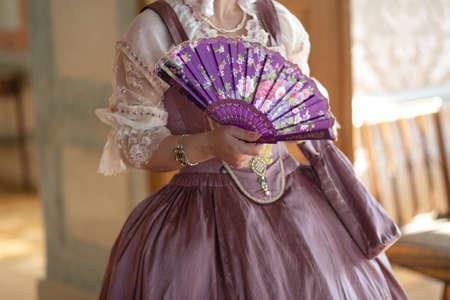 Retro style royal medieval ball - Majestic palace with gorgeous people dressed in king and queens friends dresses with accessories such as fan and hand puch as a handbag - 2019の写真素材