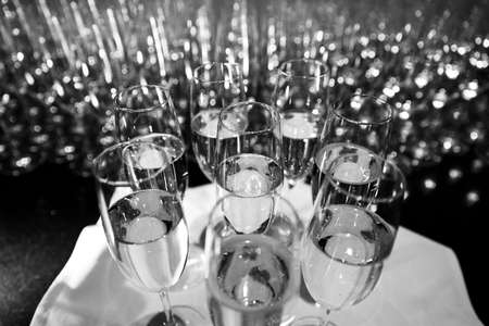 Many glass of wine at a table making a beautiful patternの写真素材