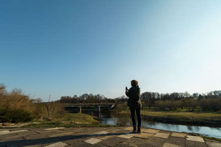 River with a bridge in the backround in Sabile, Latviaの写真素材