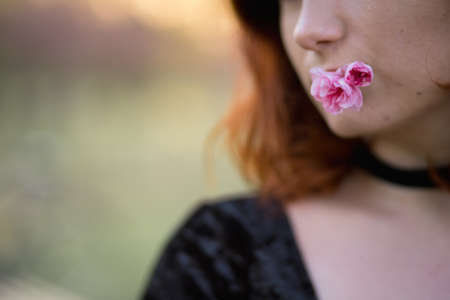 Face portrait close up - Happy young travel dancer woman enjoying free time in a sakura cherry...