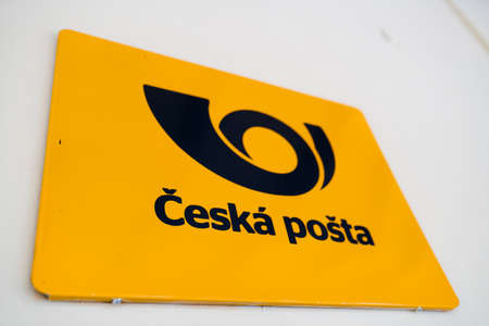 Cesky Krumlov, Czech Republic - October 28, 2019: Czech Post Ceska Posta sign of yellow color on the wall of post office - Wide angle shotのeditorial素材