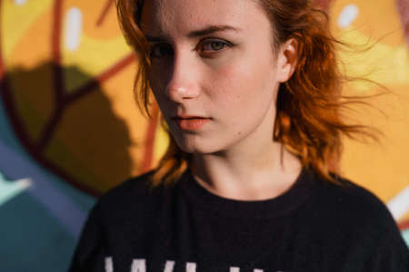 Redhead woman in black dress fashion portraits in Hipster quarter of Eastern European Baltic Riga Latvia - Tallinas kvartalsの写真素材