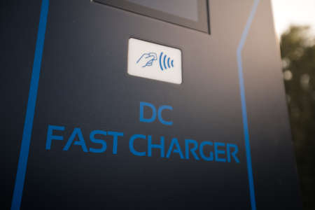 Wireless payment - Electric charger at a parking lot - DC Fast Charger in Eastern Europe Latvia Rigaの写真素材
