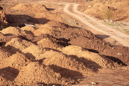 Yellow sand at construction site and the roadの写真素材