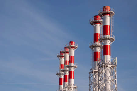 many white with red pipes new boiler room on the background of blue sky.の写真素材