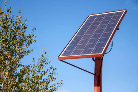 Solar battery panel in the city on sky background