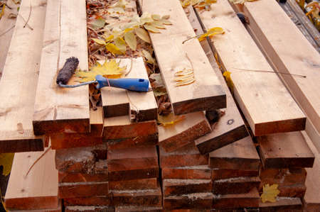 Stacked lumber. Folded wood. Closeup wooden boards.の写真素材