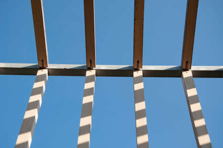 wooden beams of the frame under constructionの写真素材