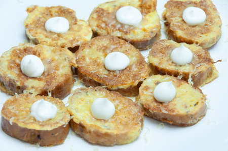 Toasted bread with cheese, eggs and mayonaise isolated on white
