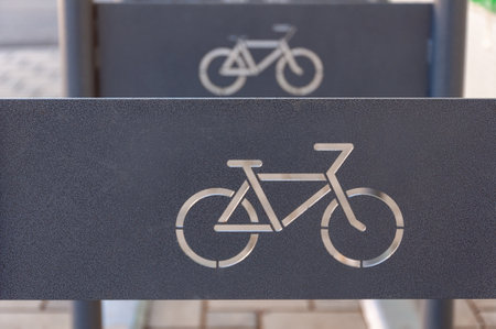 Bicycle parking sign Simple bike icon on metal rectangle Correctly labeled bicycle parking spot for pedestriansの写真素材