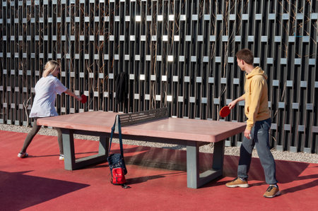 Krasnodar, Russia - April 14 2021: Students, boy and girl Relaxing And Playing Table Tennis. Table tennis, female playerのeditorial素材