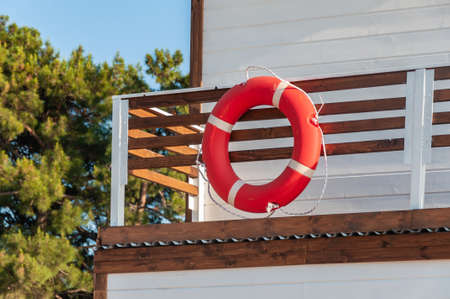 life ring hangs on the wall of the lifeguard tower. Lifelineの写真素材