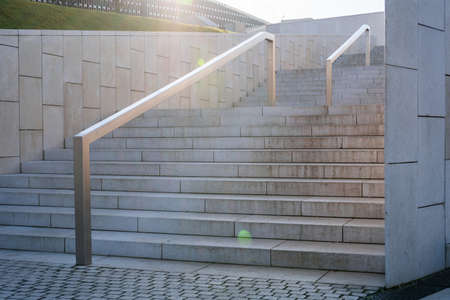 Beautiful stairs light sun on light background. Beautiful white background. Building architecture