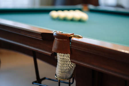 Billiard table with green surface and balls in the billiard club.の写真素材