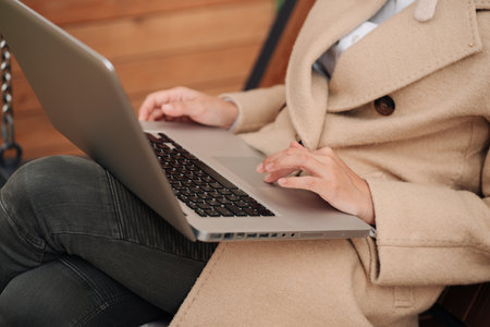 Closeup of business woman hand typing on laptop keyboardの写真素材