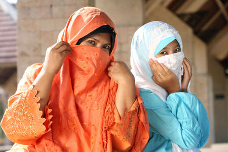 Muslim Females Cowering Faces の写真素材