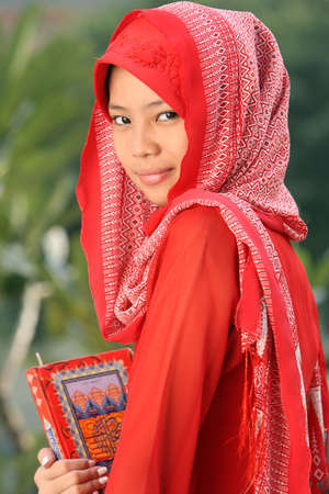 Muslim Girl Holding Qur'anの写真素材
