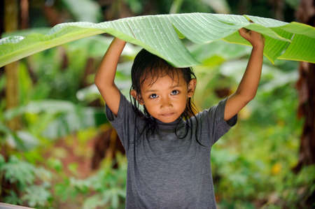 Child in a rainの写真素材