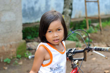 Child with bicycleの写真素材