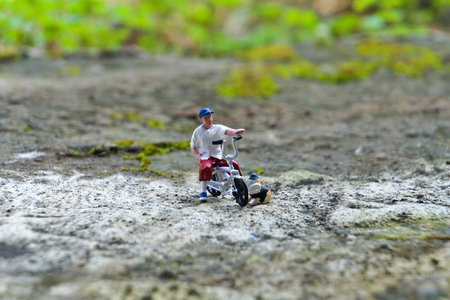 diorama a man playing bicycle BMX in the gardenの写真素材