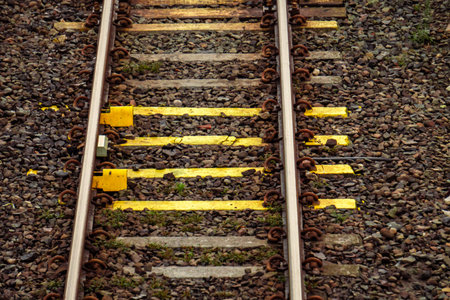 The train track is made of steel with concrete block sleepers and gravelの写真素材
