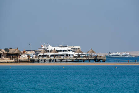 Yachts and ships on the Red SeaThe name comes from the seasonal explosions of the red cyanobacterium Trichodesmium erythraeum, from the nearby mountains, rich in red minerals or from the Himariitesの写真素材