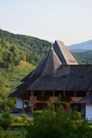 Barsana Orthodox Abbess, a multi-storey building in the Maramures style of wooden churches, with...
