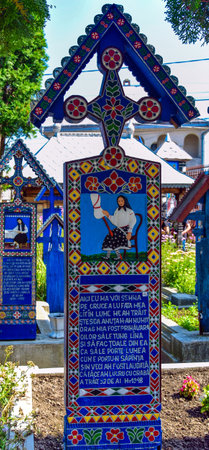 Cross from the Merry Cemetery in Sapanta Maramures the only place in the world where people laugh at death.Each cross is painted in vivid colors and tells a happy story from the life of the deceasedのeditorial素材