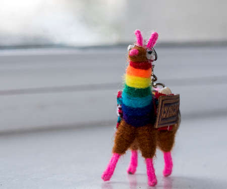 Peruvian keychain, made of Cusco alpaca wool 
The keychain is a small amulet representing a handmade alpaca made of brightly colored alpaca wool that can be attached by a ring to the owner s keysの写真素材