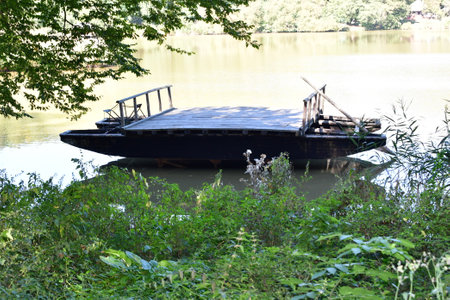 The floating cable bridge consists of two flat-bottomed boats, connected by a frame of beams, furrowed with furs, which form the loading platform.の写真素材