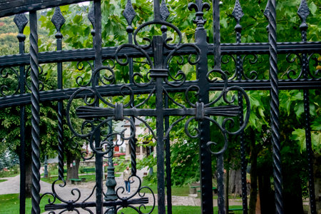 wrought iron gate in the park, close-up of photoの写真素材